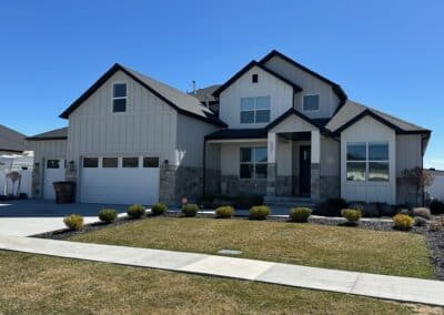 A house with upgraded finishes, stainless steel appliances, and solid surface countertops